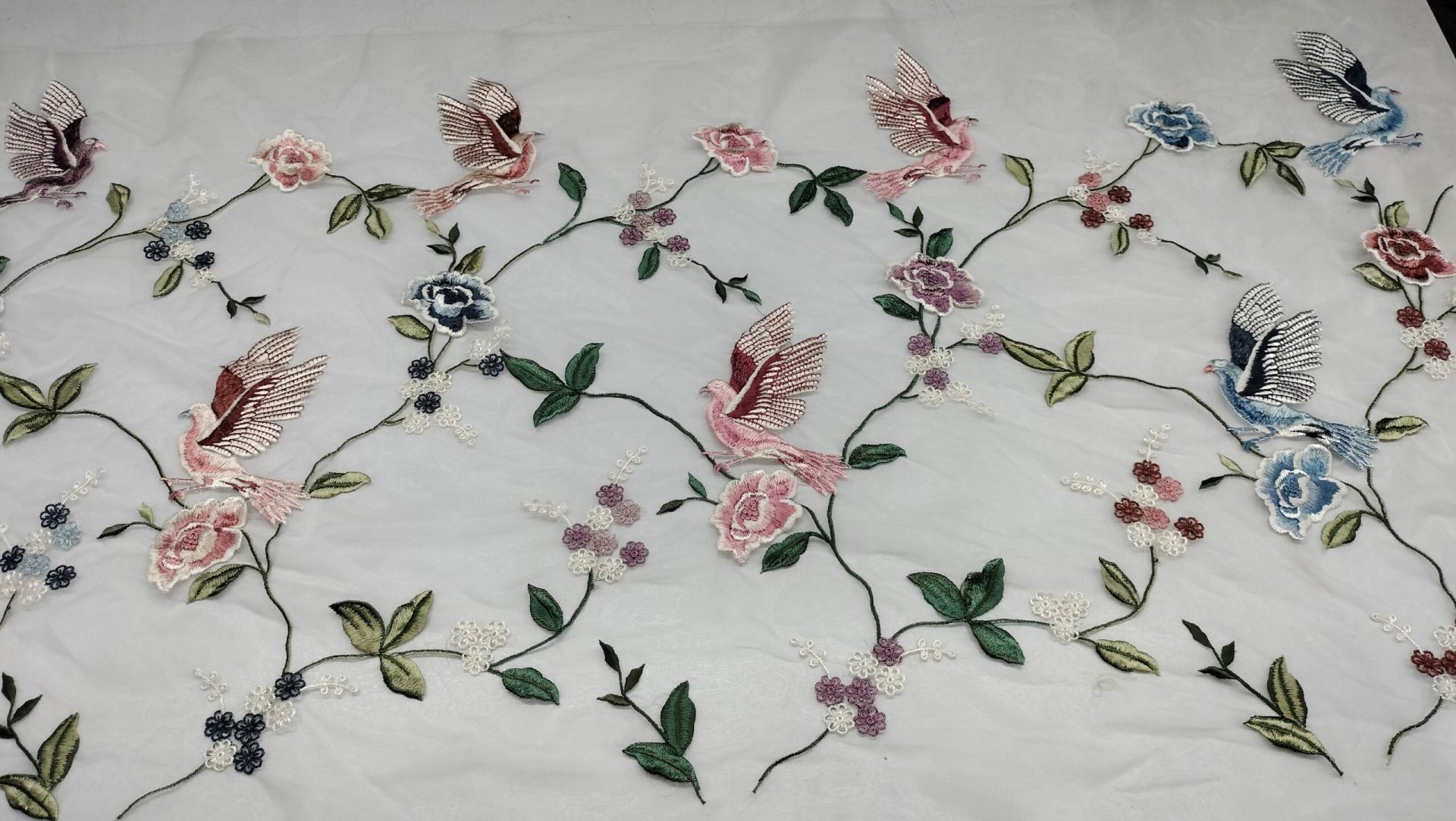 multi colored birds with flower design